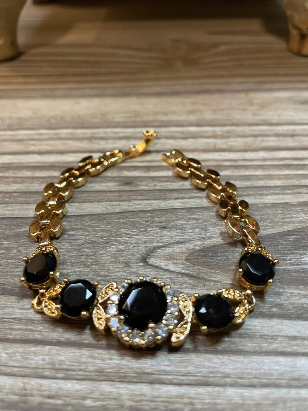 Gold-Tone Bracelet with Black Glass Gemstones and Clear Accents